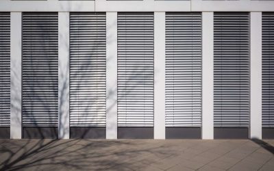 modern office building facade with closed automated exterior blinds