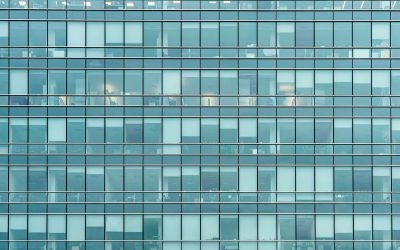 Glass facade texture of a modern office building. High tech architecture. Elements of urban design. Windows of skyscraper tower.