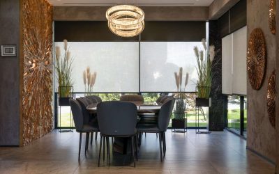 Roller blinds on the windows in the interior. Automatic double solar and blackout shades large size. Modern interior with wood decor panels on the wall. Electric sunscreen curtains for home.