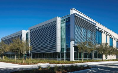 Exterior building facade with horizontal aluminum louver windows, designed for privacy and shade.