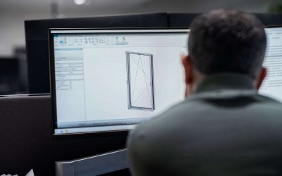 Professional using computer aided design software to model window frame with technical specifications